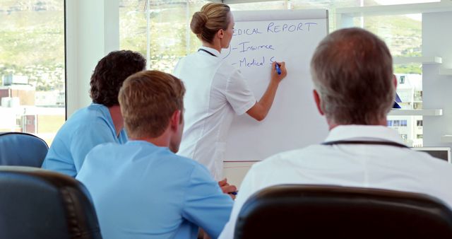 Medical Team Attending Presentation in Conference Room - Download Free Stock Images Pikwizard.com