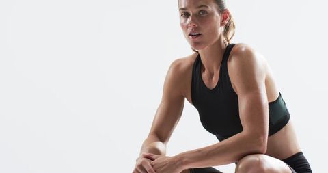 Athletic Woman Practicing Yoga Pose in Minimalist Space