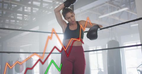 Female Boxer Resting in Ring with Analytics Overlay for Fitness Performance Concept