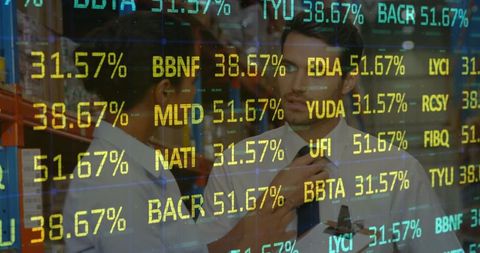 Warehouse supervisors analyzing stock market data overlay