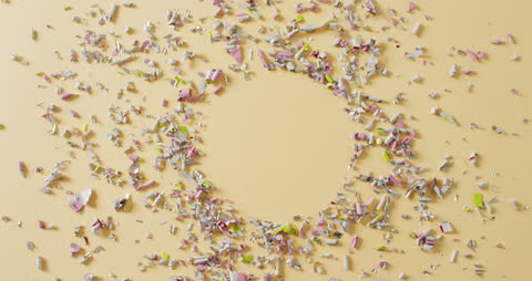 Colorful Confetti Surrounding Circular Copy Space on Yellow Background