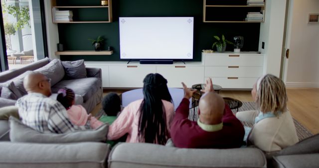 Family Watching Television Together in Modern Living Room - Download Free Stock Images Pikwizard.com