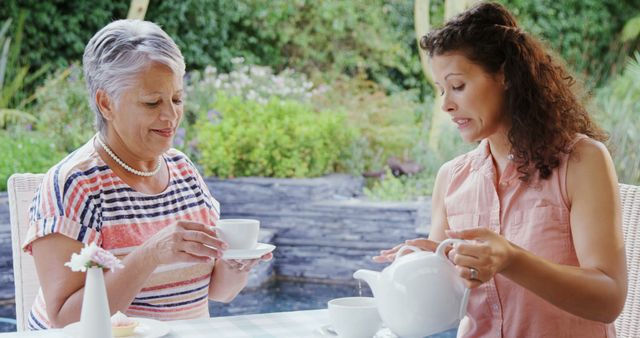 Happy Women Drinking Tea and Talking in Garden - Download Free Stock Images Pikwizard.com