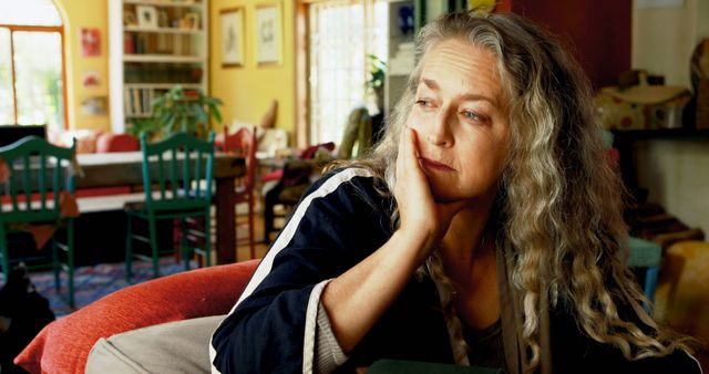 Pensive Woman in Cozy Living Room Reflecting on Life - Download Free Stock Images Pikwizard.com