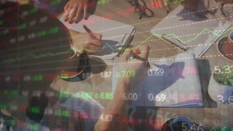 Business Colleagues Analyzing Market Data Discussing Strategies