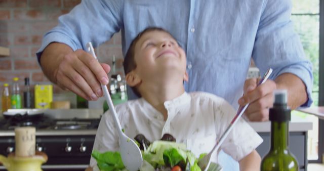 Father and Son Preparing Healthy Salad in Kitchen - Download Free Stock Images Pikwizard.com