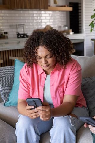 Friends Using Smartphones in Modern Open Kitchen Living Area