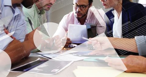 Financial Analysis Meeting with Business Professionals in Office