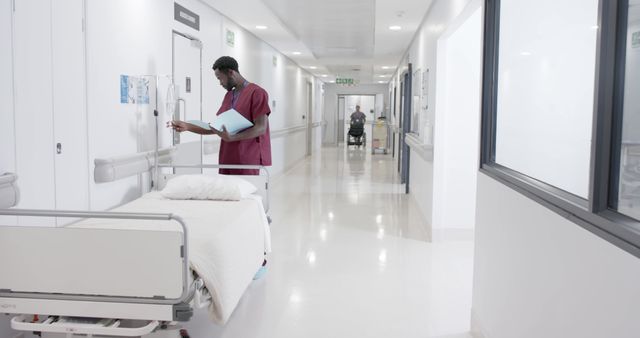 Healthcare Professional in Hospital Corridor Checking Equipment - Download Free Stock Images Pikwizard.com