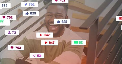 Laughing man receiving social media notifications overlay on wooden stairs for influencer marketing