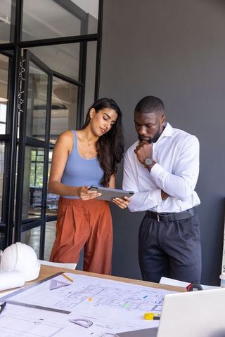 Diverse Professionals Collaborating on Architectural Project