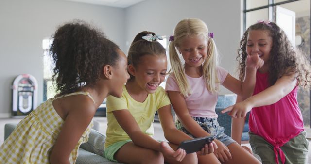 Diverse Group of Girls Laughing in School Common Room with Smartphone - Download Free Stock Images Pikwizard.com