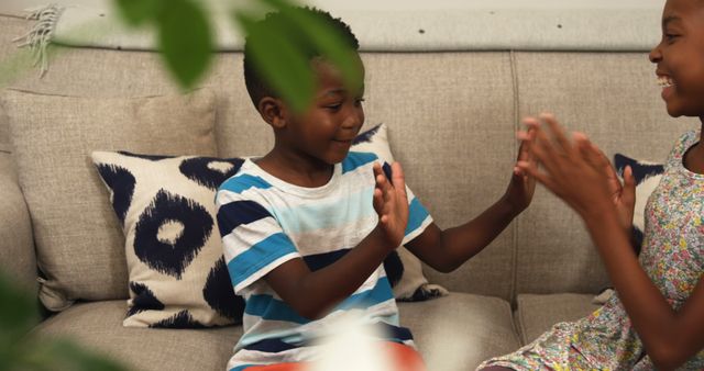 Kids Playing Clap Game on Couch Indoors - Download Free Stock Images Pikwizard.com