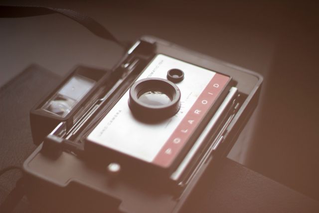 Vintage Polaroid Camera with Abstract Blurred Background - Download Free Stock Photos Pikwizard.com
