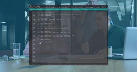 Developers Reviewing Code in Modern Office with Terminal Overlay on Laptop Screen