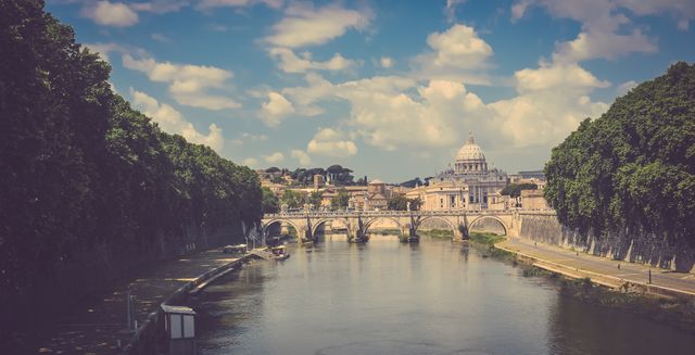 Peaceful River View of St. Peter's Basilica and Historic Bridge in Vatican City - Download Free Stock Photos Pikwizard.com