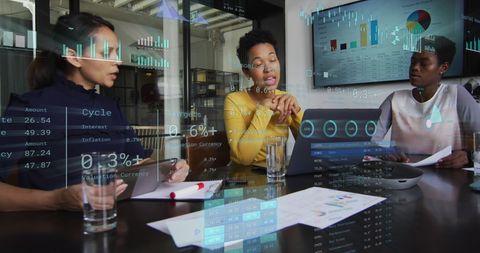 Business Team Analyzing Financial Data with Technological Interface