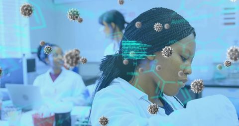 Female Scientists Analyzing Covid-19 Data with Digital Overlay