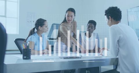 Diverse Business Team Collaborating with Analytics Graphic Overlay