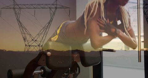 Woman performing roman chair back extension lifting torso with powerline double exposure