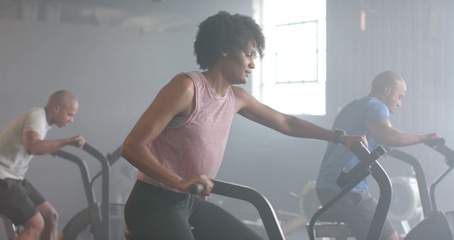 Group of Diverse People Exercising on Stationary Bikes at Gym - Download Free Stock Images Pikwizard.com