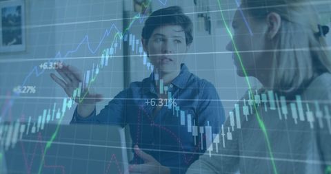 Business Colleagues Analyzing Financial Charts in Meeting