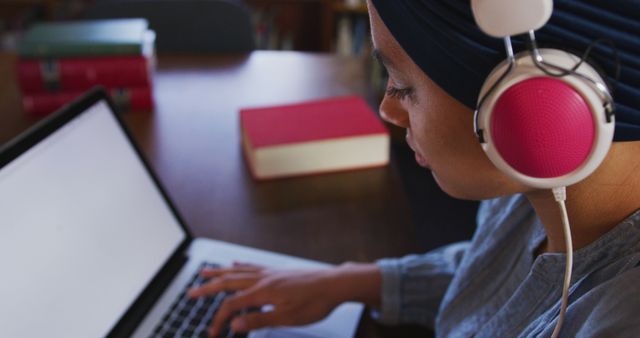 Young Woman Studying on Laptop with Headphones - Download Free Stock Images Pikwizard.com