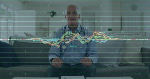 Senior doctor sitting on sofa wearing stethoscope reviewing digital health charts analytics overlay