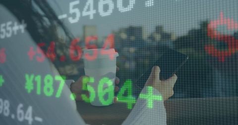 Businesswoman Using Smartphone Amidst Urban Stock Market Display
