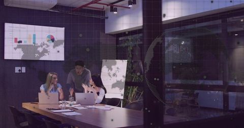 Corporate Team Analyzing Charts in Modern Meeting Room