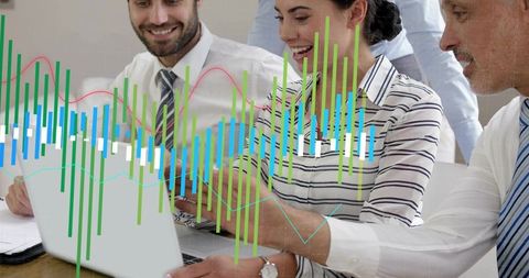 Business team collaborating over laptop while analyzing financial charts and analytics