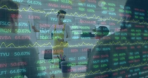 Multiracial team analyzing stock market trends in office