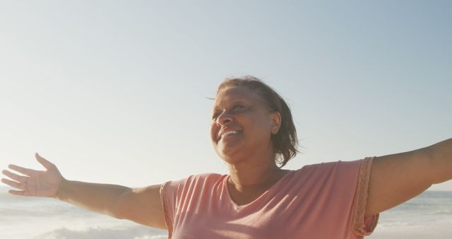 Joyful Senior Woman with Open Arms at the Beach - Download Free Stock Images Pikwizard.com