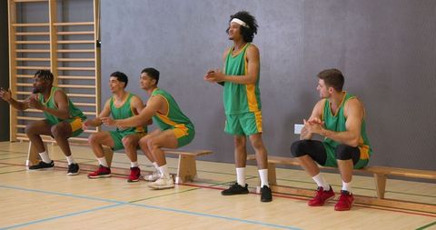 Basketball Players Preparing for Game with Energy and Team Spirit