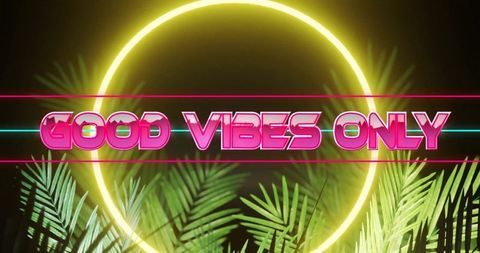 Vibrant neon sign saying good vibes only with tropical elements