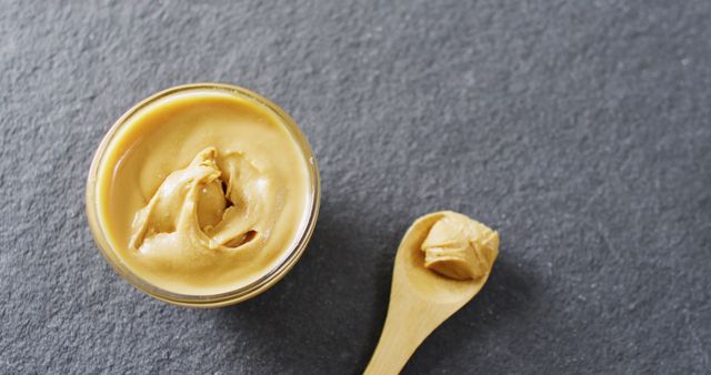 Creamy Peanut Butter in Jar with Wooden Spoon on Slate Surface - Download Free Stock Images Pikwizard.com