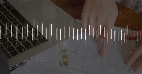 Analyzing financial spreadsheet with laptop and waveform overlay showing data analytics