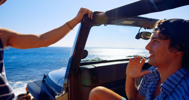 Friends Enjoying Road Trip with Ocean View in Convertible Car - Download Free Stock Images Pikwizard.com