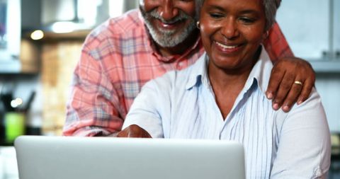 Senior Couple Using Laptop Together at Home Kitchen - Download Free Stock Images Pikwizard.com