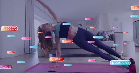 Woman holding side-plank with augmented reality fitness tags in modern living room