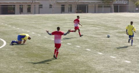 Soccer Athletes Participating in Intense Field Game