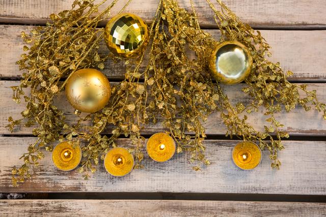 Golden Christmas Decorations on Rustic Wooden Plank - Download Free Stock Photos Pikwizard.com