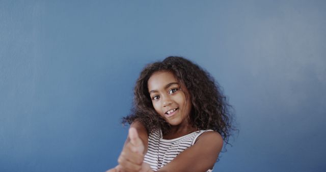 Joyful Girl Wearing Striped Tank Top Posing with Enthusiasm - Download Free Stock Images Pikwizard.com