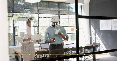 Team Brainstorming with Technology and VR in Modern Office Setting