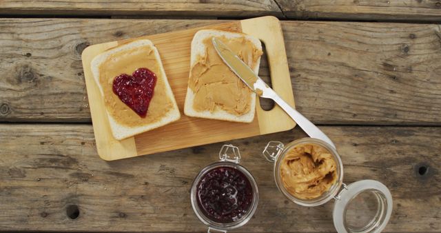 Close up view of peanut butter and jelly sandwich on wooden tray on wooden surface. food and nutrition concept