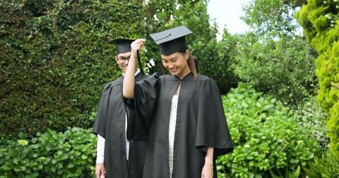 Joyful Outdoors Graduation Celebration in Caps and Gowns