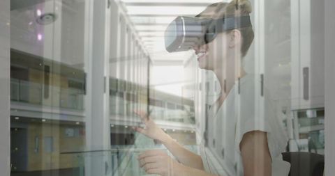 Innovative Woman Using VR Headset Blending with Server Room - Download Free Stock Images Pikwizard.com