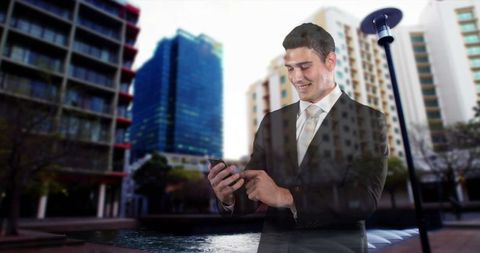 Smiling businessman engaging with smartphone in urban environment