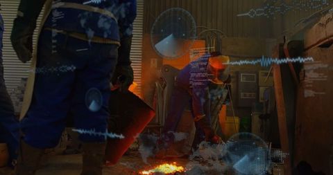 Metalworkers pouring molten metal in industrial foundry workshop