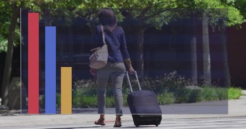 Businesswoman Walking with Suitcase and Financial Chart Overlay